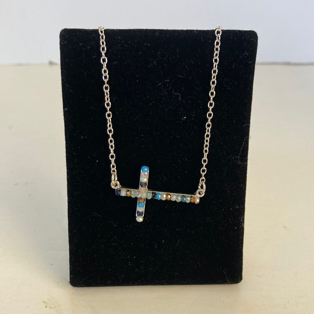 Z145 New adjustable choker that is silver with multi colored beans in cross.